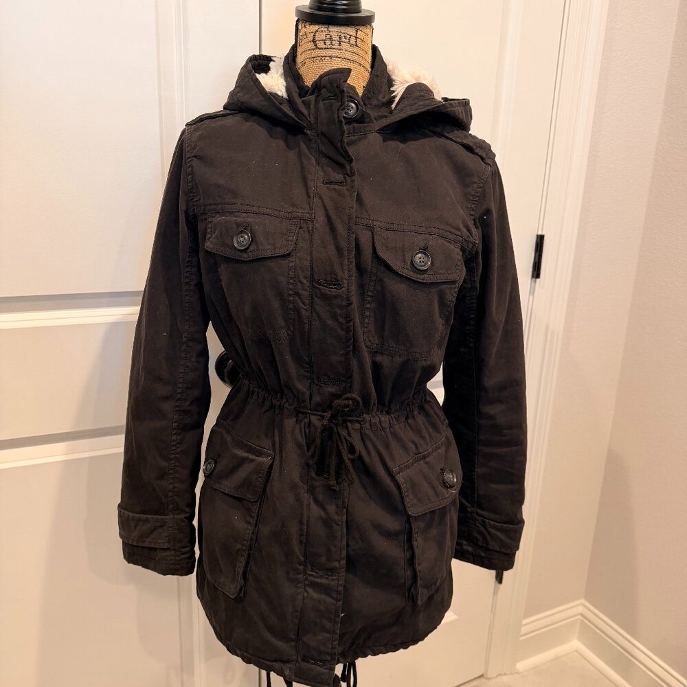 Aritzia Talula black utility jacket with a soft faux fur–lined interior